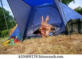 Feet sticking out of a tent