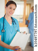 Female intern showing a clipboard
