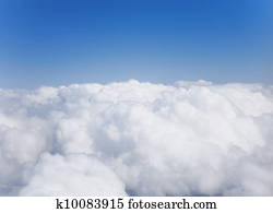 Fluffy white cumulus clouds against the sky