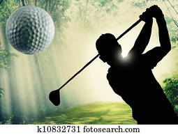 Golfer putting a ball on the green 