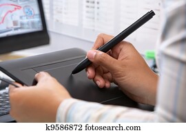 Graphic designer wotking using pen tablet Graphic designer wotking using pen tablet