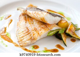 Grilled turbot fish with vegetables.