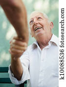 Group of happy elderly men laughing and talking