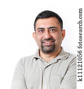 Handsome and happy middle aged mature indian adult business man looking with satisfaction and happiness. The person is wearing t-shirt and photo is shot in studio with white background