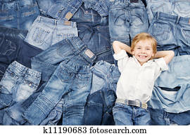 Happy child on jeans background