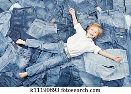 Happy child on jeans background