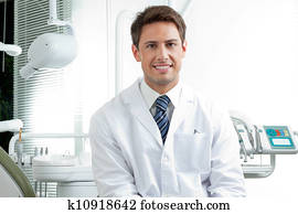 Happy Male Dentist In Clinic Happy Male Dentist In Clinic