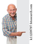 happy smiling senior man holds a blank board