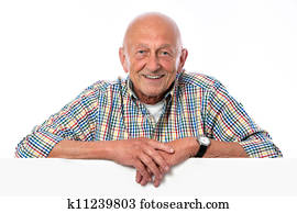happy smiling senior man holds a blank board
