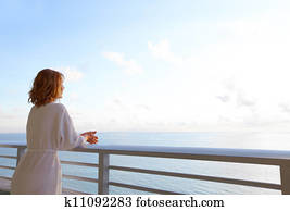 Happy woman looking on the ocean. Happy woman looking on the ocean.