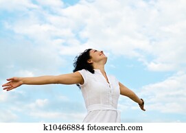 Happy woman with outspread arms