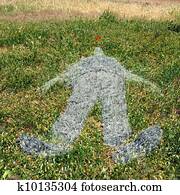 human figure imprinted on grass
