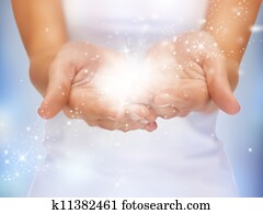 magic twinkles on female hands magic twinkles on female hands