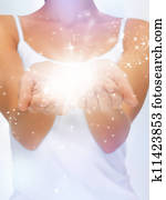 magic twinkles on female hands magic twinkles on female hands