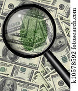 Magnify glass and fingerprint on US currency