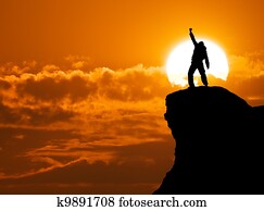 Man on top of mountain