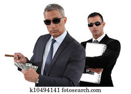 Men counting money Men counting money