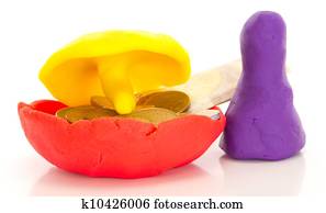 Modelling clay figure with umbrella and money