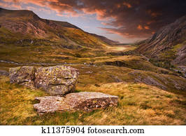 Moody dramatic mountain sunset landscape