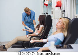 Nurse looking after a blood donor