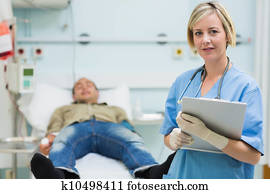 Nurse next to a male patient
