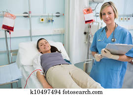 Nurse next to a patient while standing