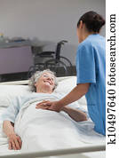 Nurse taking care of an elderly patient