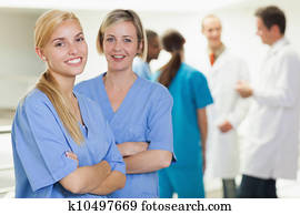 Nurses looking at camera while smiling Nurses looking at camera while smiling