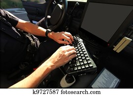 Officer Using in Vehicle Computer for Public Safety