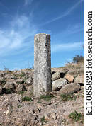 Old milestone made of granite 
