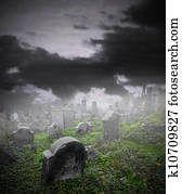 Old ruined graveyard in mystery fog