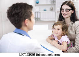 Pediatrician talking to mother and child Pediatrician talking to mother and child