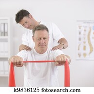 Physiotherapy: Senior man and physiotherapist Physiotherapy: Senior man and physiotherapist
