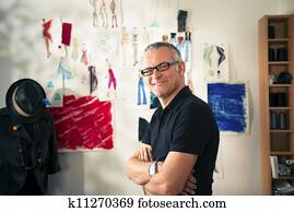 Portrait of happy woman working as fashion designer