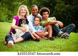 Portrait of mixed race family at park