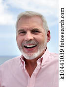 Portrait of senior man laughing