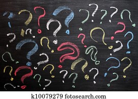 Question marks on chalkboard. Decision, confusion, FAQ or other concept. Hand writing with chalk on school black board. Question marks on chalkboard. Decision, confusion, FAQ or other concept. Hand writing with chalk on school black board.
