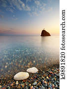 Sea and rock at the sunset