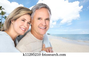 Senior couple on the beach.