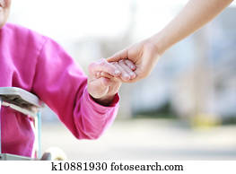 Senior Lady in Wheelchair Holding Hands Senior Lady in Wheelchair Holding Hands