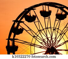 Silhouette of ferris wheel at sunset at county fair. Silhouette of ferris wheel at sunset at county fair.