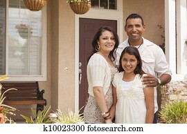 Small Hispanic Family in Front of Their Home Small Hispanic Family in Front of Their Home