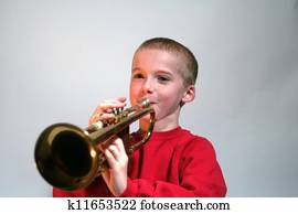Smiling Boy Playing Trumpet