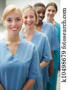 Smiling female nurses looking at camera