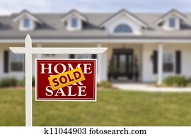 Sold Home For Sale Sign in Front of New House 