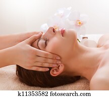 Spa Massage. Young Woman Getting Facial Massage