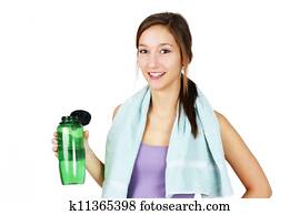 Sporty young woman with water