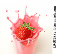 Strawberry splashing into a glass full of milkshake. Strawberry splashing into a glass full of milkshake.