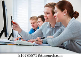students attending training course in a computer classroom students attending training course in a computer classroom