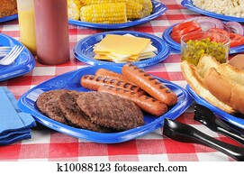 Summer picnic table loaded with food Summer picnic table loaded with food